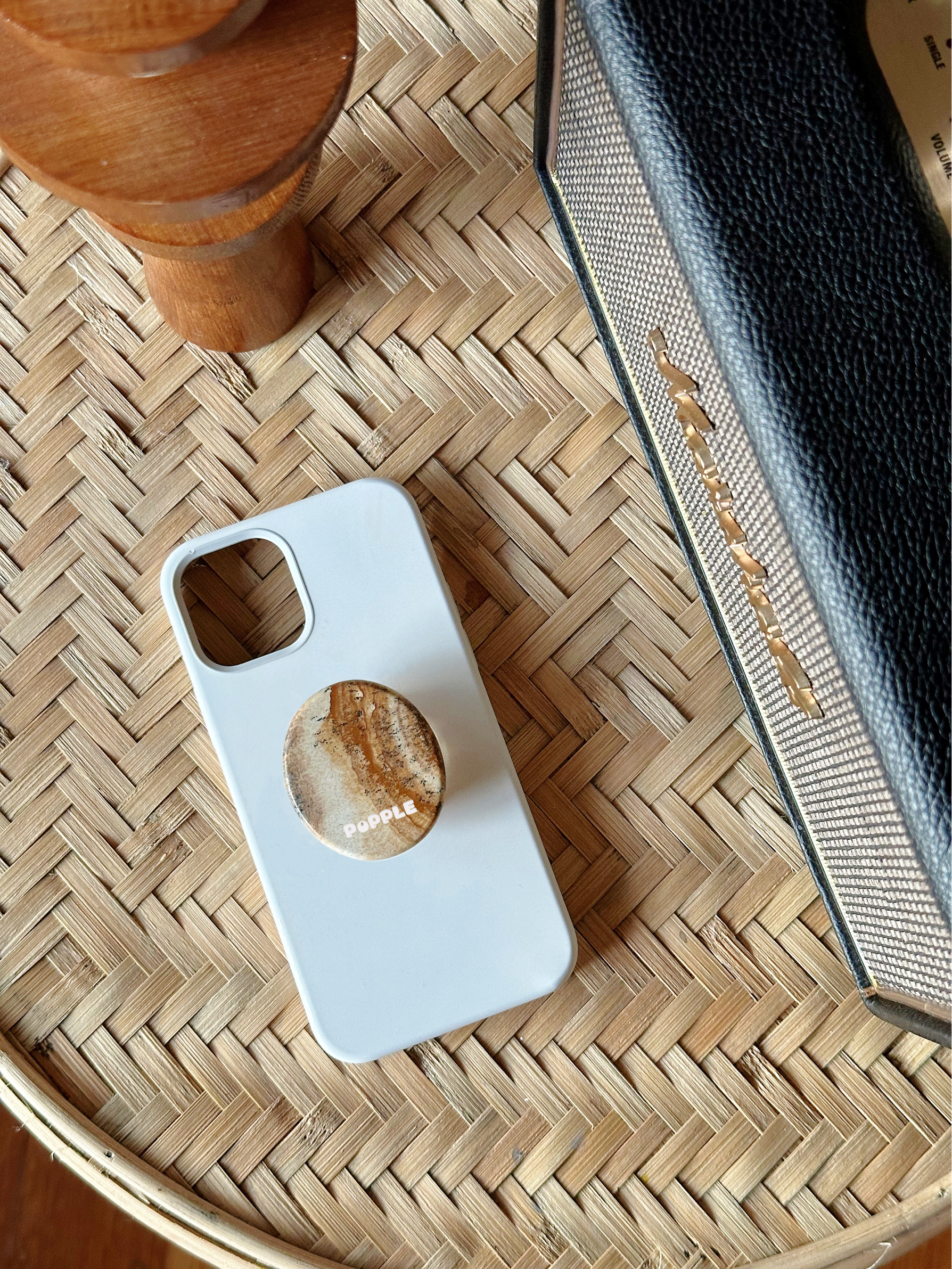 A phone case and a Adhesive Base phone grip with the picture Jasper natural stone.